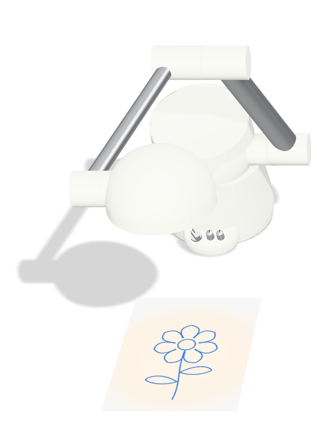 Tangi drawing a flower in light on a sheet of paper
